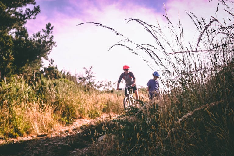 Two People Riding Bicycle