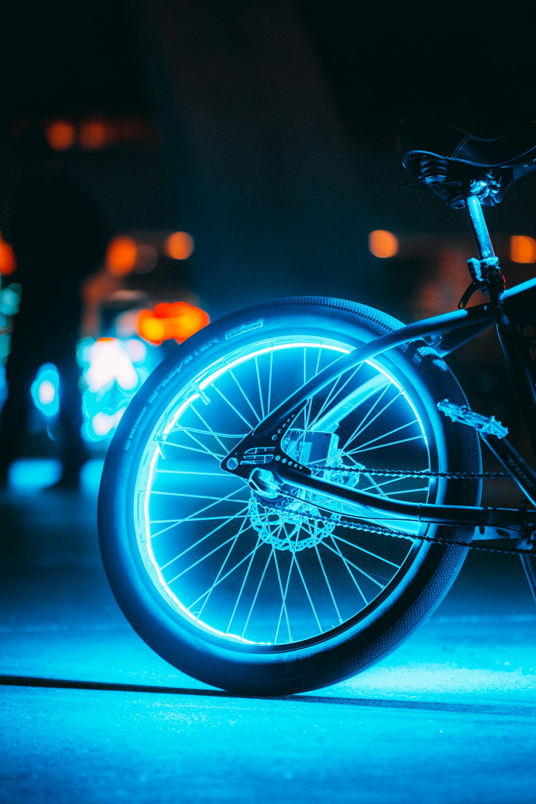 Rear Wheel of Bike Illuminated in Blue