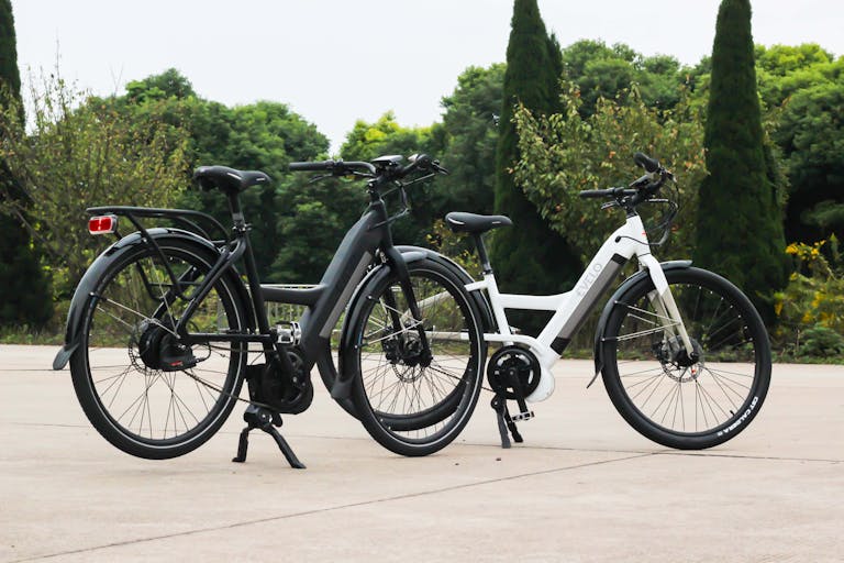 Two bicycles are parked next to each other