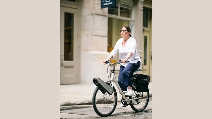 woman riding bike with clip device