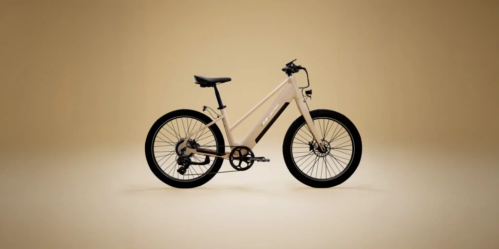 Toasted Marshmallow Lectric XPress Lite mid-step commuter e-bike shown in side profile against a beige studio background